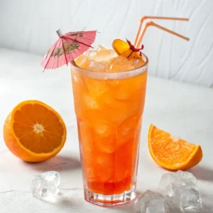 Futuristic orange mocktail with glowing citrus and mint in a sci-fi glass